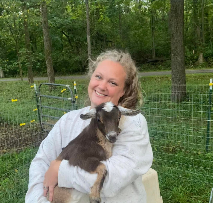 Heather Denham with a goat